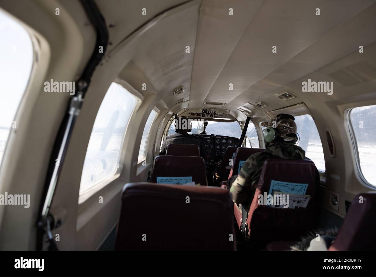 Pilot and passenger in a small airplane in Alaska Stock Photo
