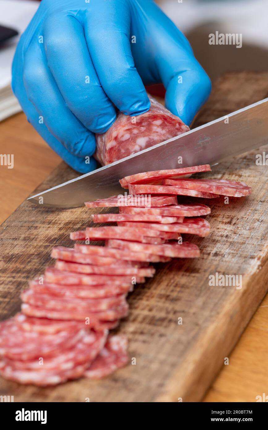 Salami on slicer stock photo. Image of piece, snack, meaty - 15910206