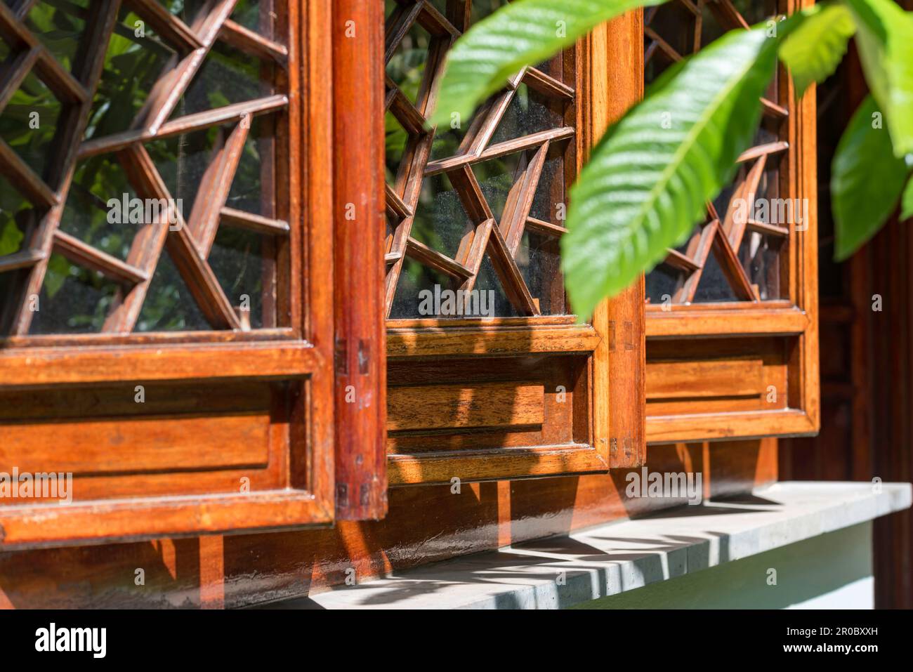 A close-up detail shot of timber window frames with intricate glazing at the Chinese Gardens of Friendship in Sydney, Australia Stock Photo