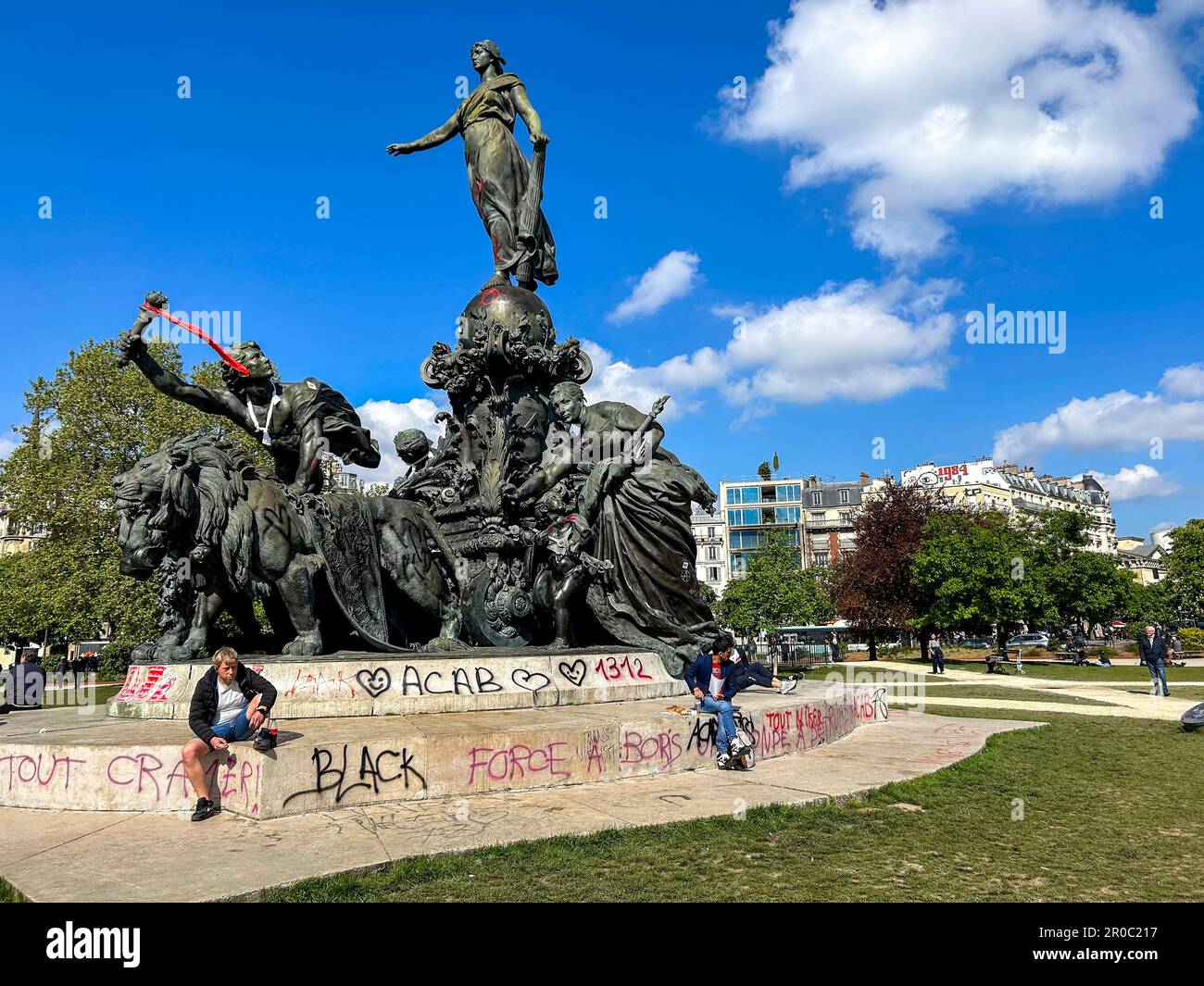 Paris, France, Damage to CIty After Anti-Government, Anti-Macron, Anti-Retirement Law Reform Demonstrations, Graffitti Slogans , Public Statue, Place de la Nation 2023 Stock Photo