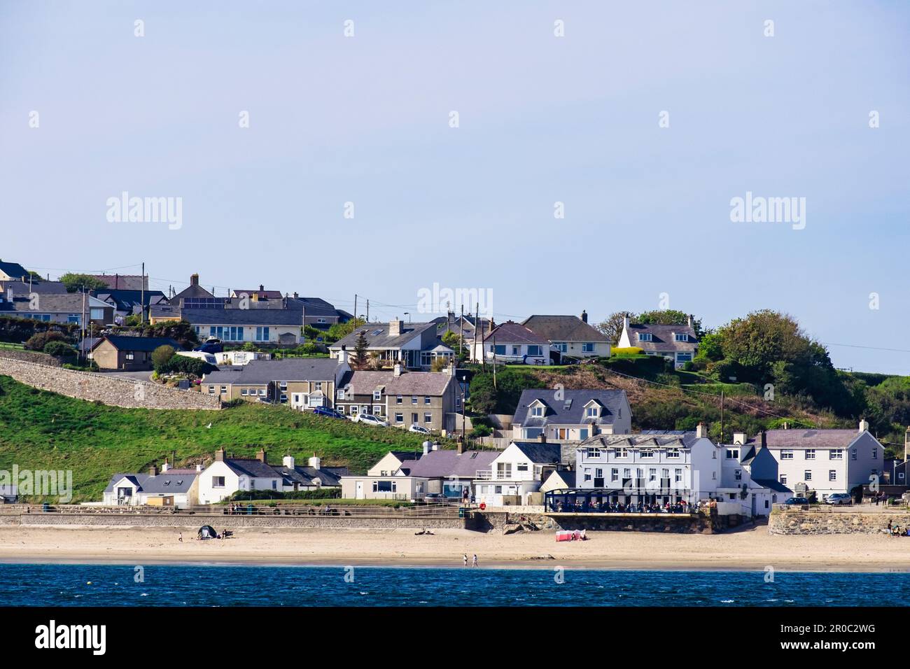 Offshore view across sea to beach and seafront in Aberdaron, Llyn Peninsula, Gwynedd, north Wales, UK, Britain Stock Photo
