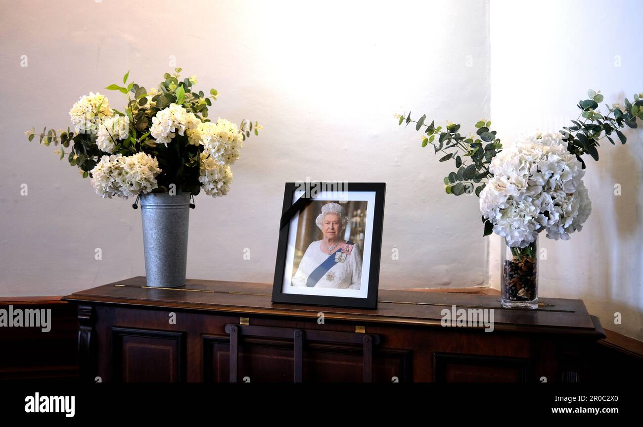 framed photograph of her late majesty queen elizabeth II,with vase of flowers,kings hall,herne bay,east kent,uk may 2023 Stock Photo