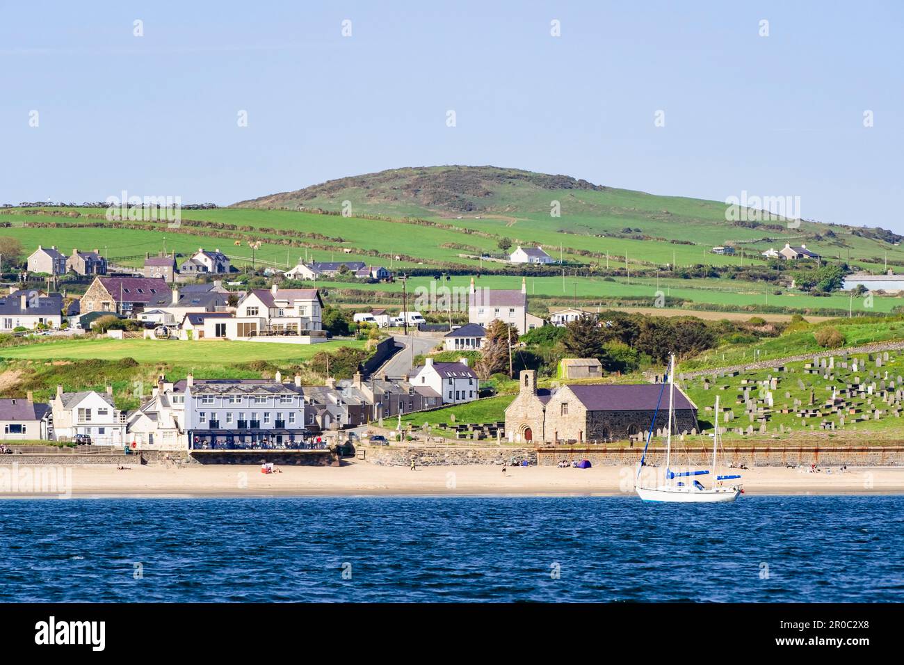 Offshore view across sea to beach and seafront in Aberdaron, Llyn Peninsula, Gwynedd, north Wales, UK, Britain Stock Photo