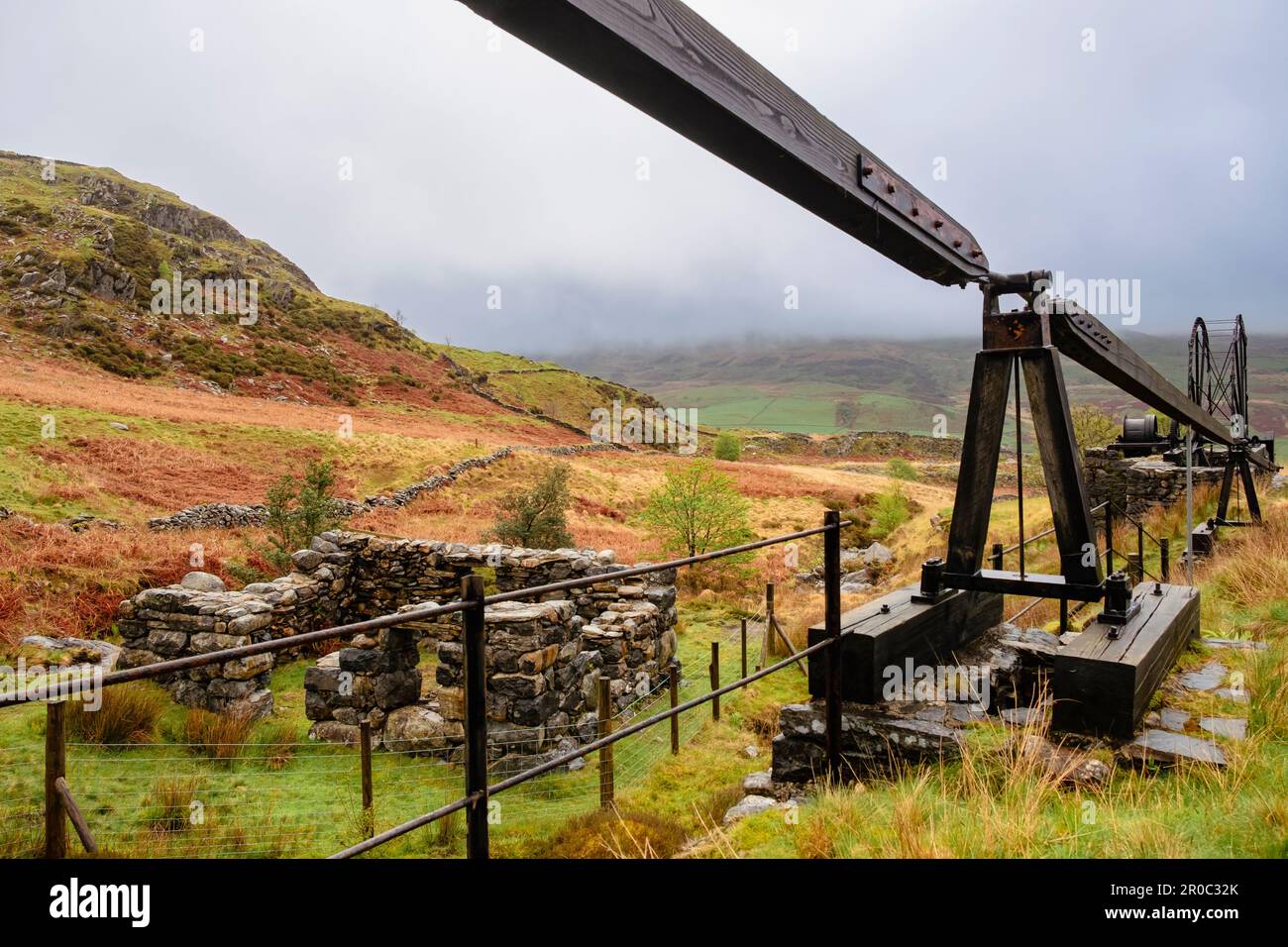 Remains of Cwm Ciprwth Copper Mine above Cwm Pennant in Snowdonia National Park. View along restored flat rods and water wheel. Gwynedd Wales UK Stock Photo
