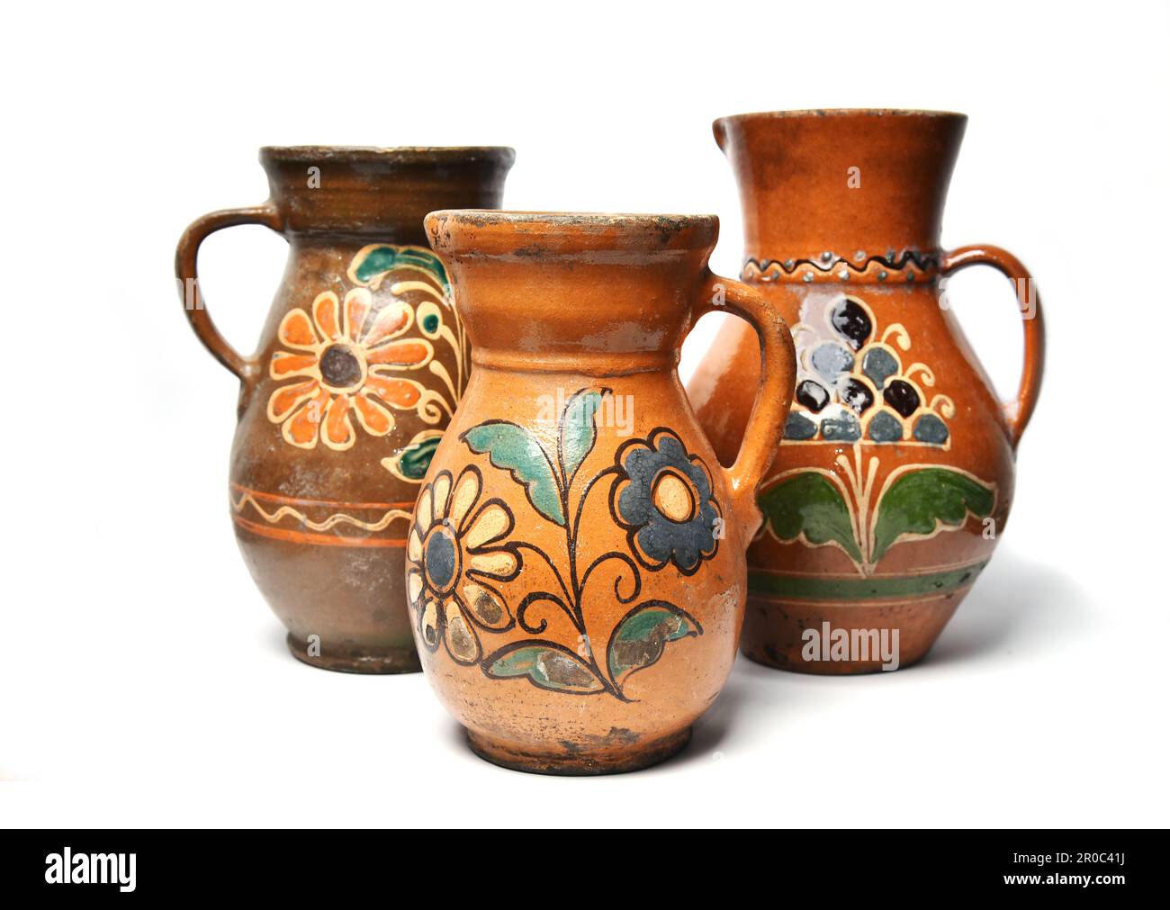 Old ceramic clay jugs on a white background. Stock Photo