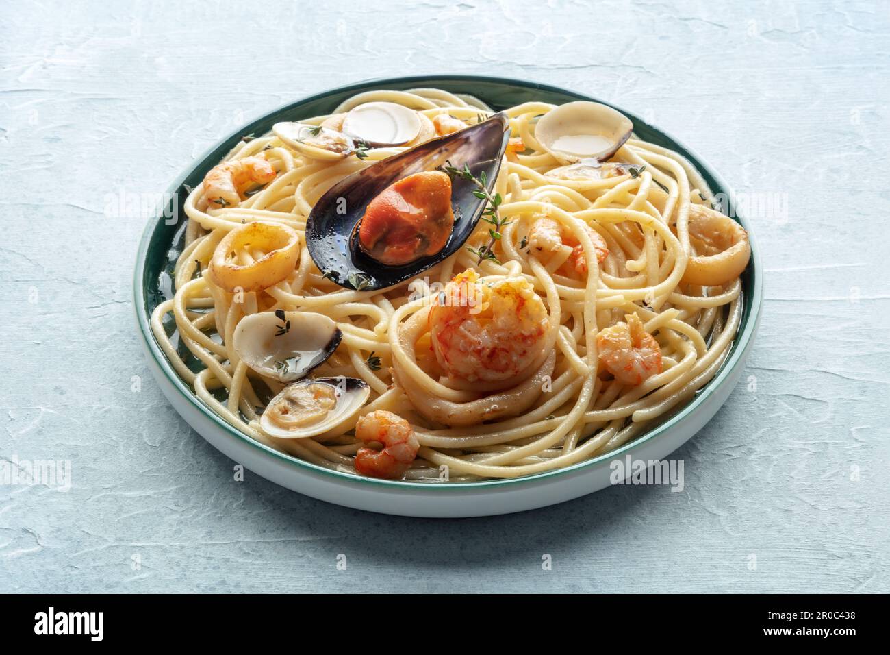 Seafood pasta plate. Spaghetti with mussels and calamari, shripms and