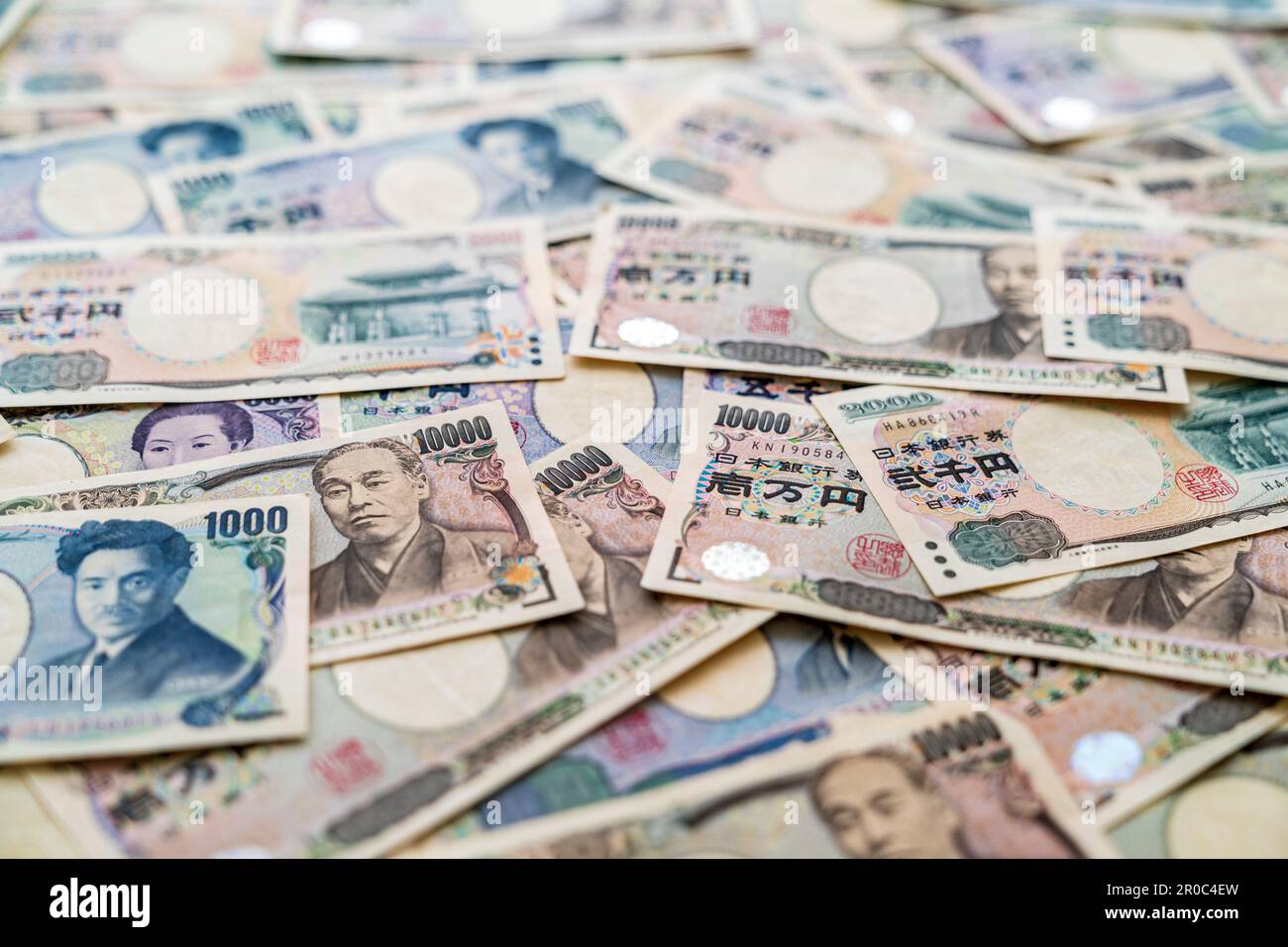 Japanese currency. View looking down at a pile of Japanese banknotes in ...