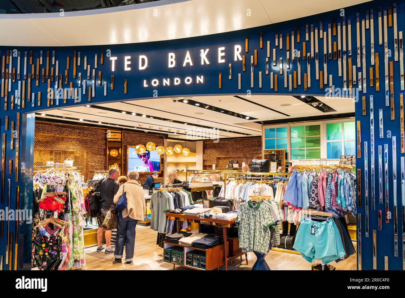 Ted Baker fashion clothing store in the Departure Lounge of Terminal 3,  heathrow airport. Entrance to shop with customers insider looking at goods  Stock Photo - Alamy
