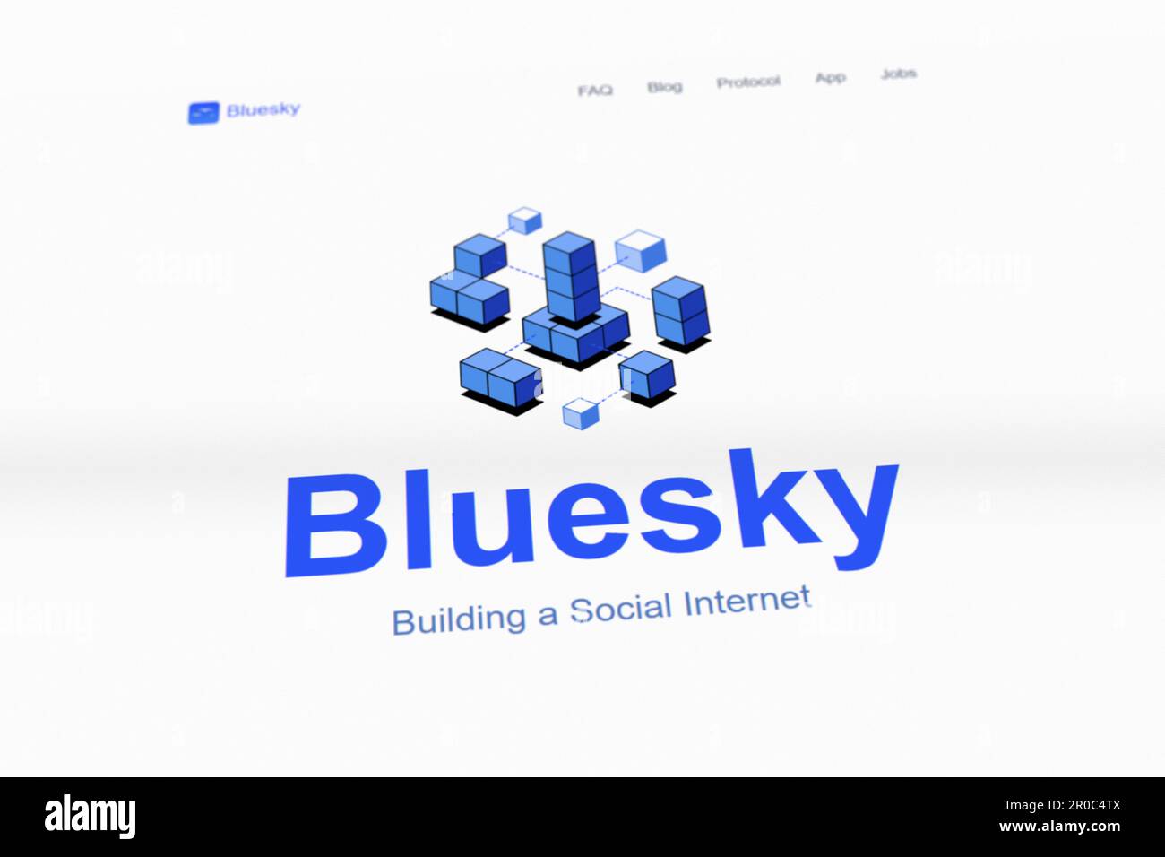 Photograph of a screen of the new social media site Bluesky Social. Selective focus. Stock Photo