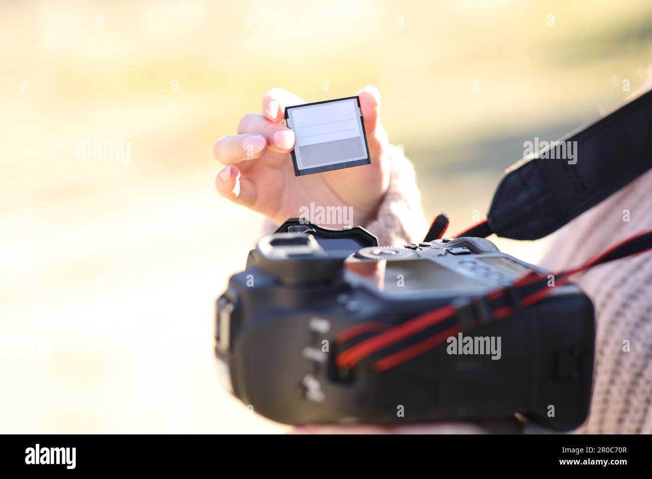 Close up of a photographer changing card on dslr camera Stock Photo