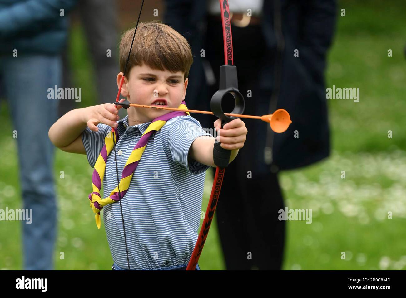 Britain's Prince Louis tries his hand at archery while taking part in the Big Help Out, during a visit to the 3rd Upton Scouts Hut in Slough, England, Monday, May 8, 2023. People across Britain were on Monday asked to do their duty as the celebrations for King Charles III's coronation drew to a close with a massive volunteering drive. (Daniel Leal/Pool Photo via AP) Stock Photo