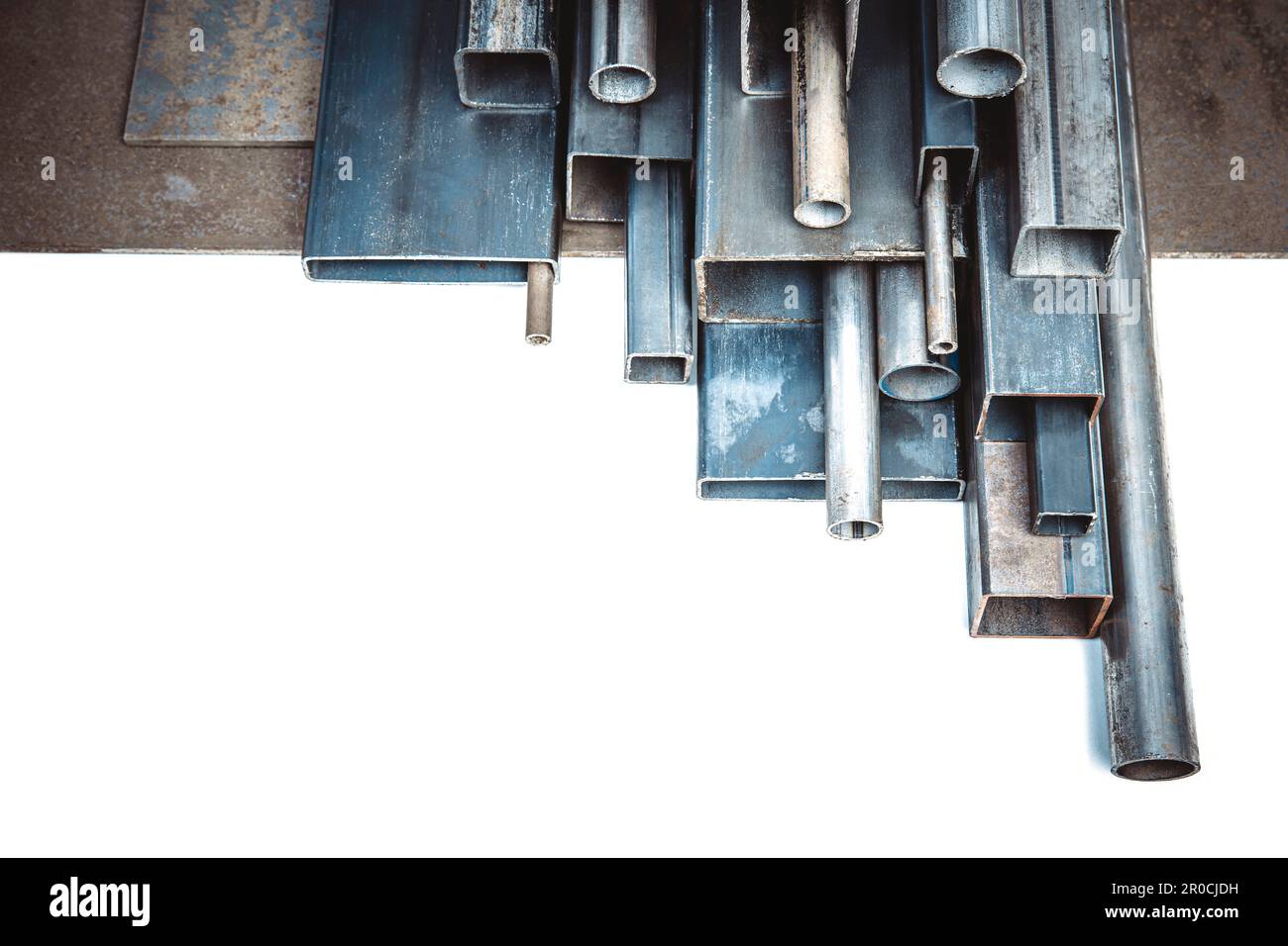 Metal profiles of different shapes and sizes on a white background Stock Photo