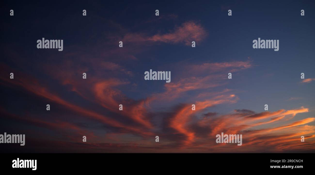 Sunset sky with orange clouds. Nature background Stock Photo - Alamy