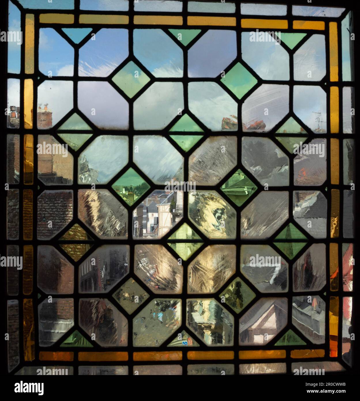 https://c8.alamy.com/comp/2R0CWWB/rouen-looking-through-a-stained-glass-window-from-an-upper-floor-of-the-gros-horloge-museum-to-a-street-in-the-historic-city-centre-2R0CWWB.jpg