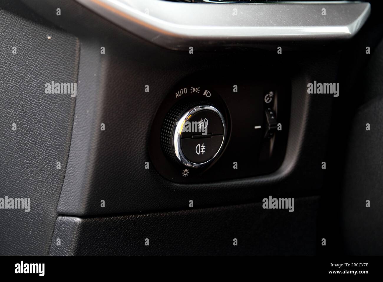 Close up headlamp switch button inside car. Selective focus. Stock Photo
