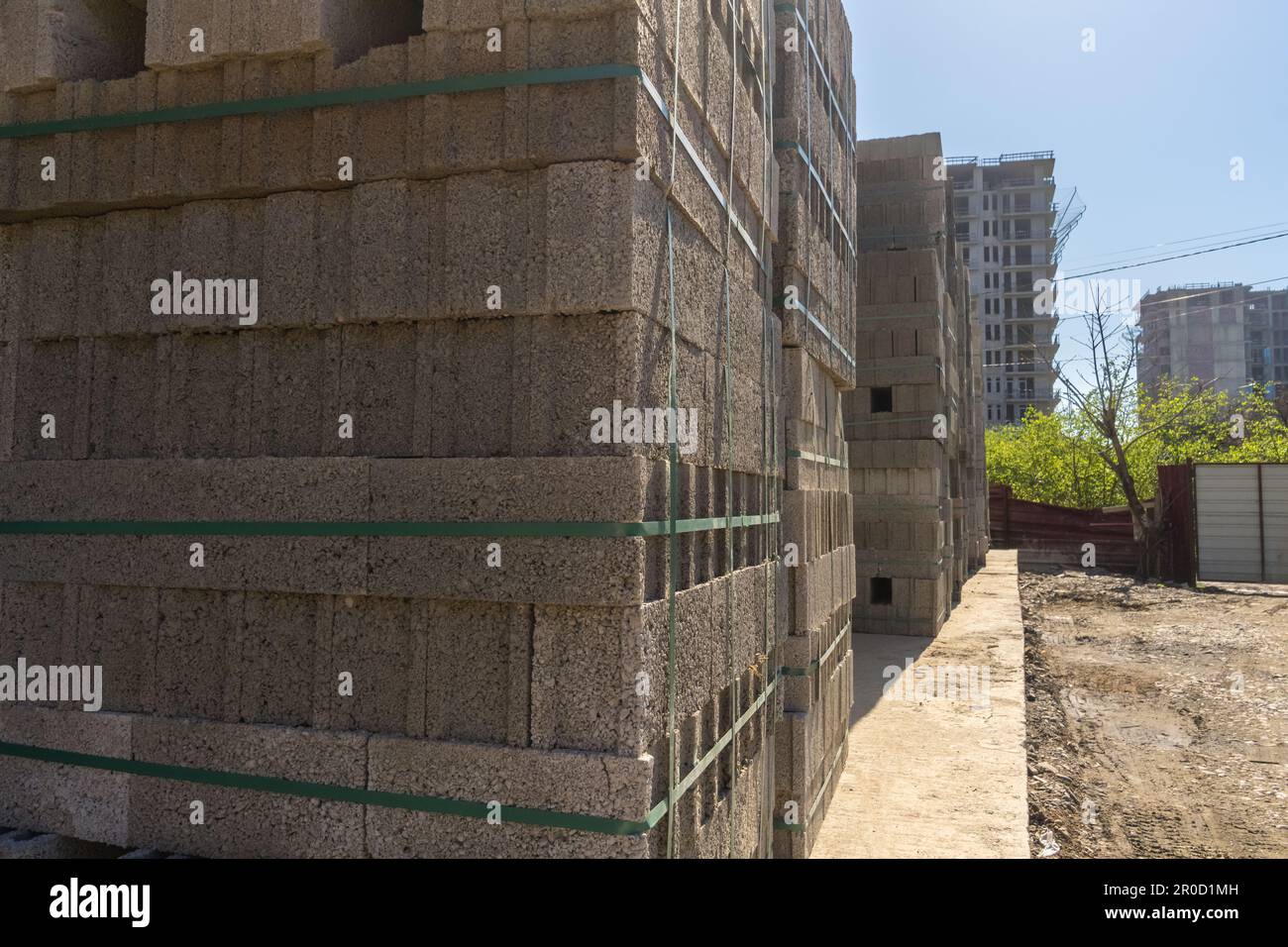 Close-up of a large number of concrete cinder blocks, gray homogeneous ...