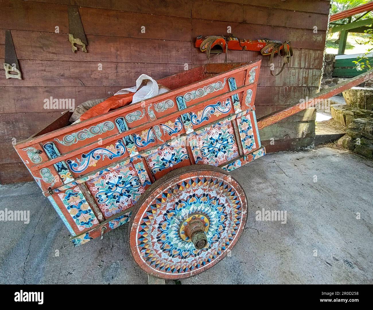 San Ramon, Costa Rica - A painted Costa Rican oxcart (carreta) on the grounds of the restaurant el Jardin. The oxcart is important in Costa Rican hist Stock Photo