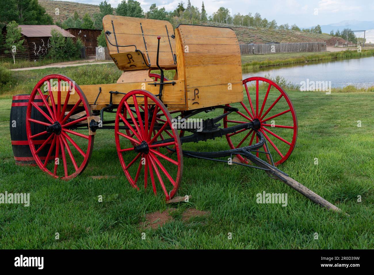 Picturesque Wagon with Red Wheels at Latigo Dude Ranch in Colorado Stock Photo