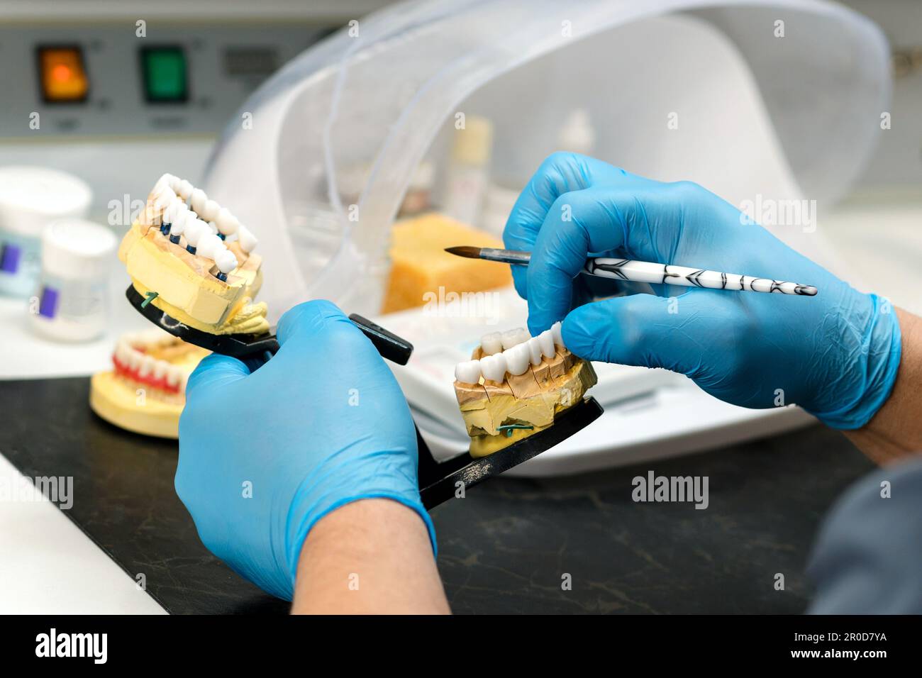 Dental prosthesis work. Denture work. Teeth painting. Dental technician