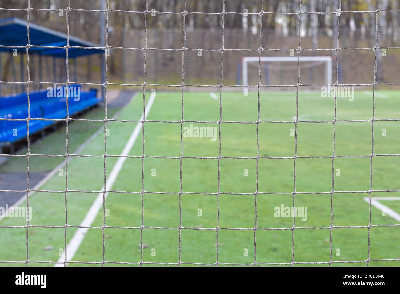 safety net on an empty football field. soccer field net. mini football
