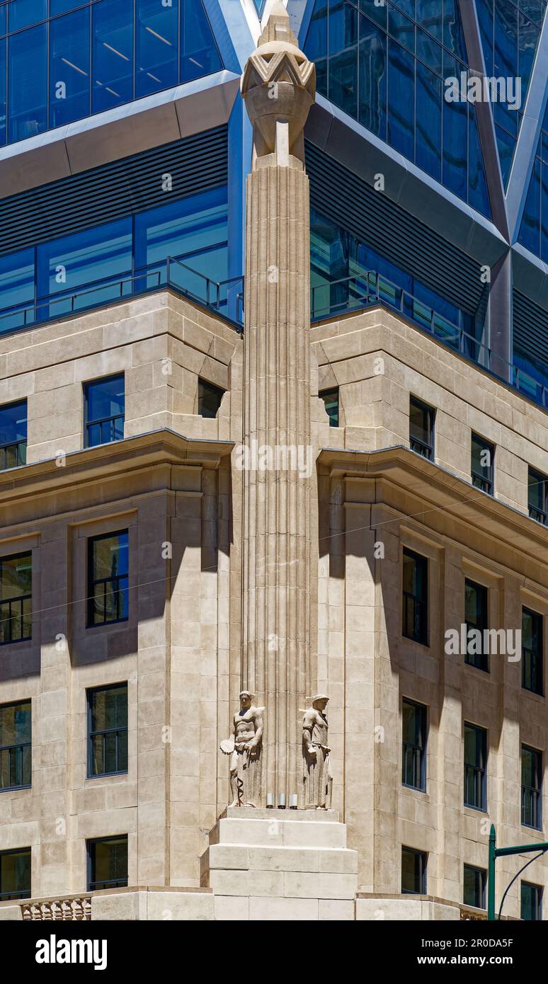 The diagrid glass Hearst Tower was built in 2006 atop the stone Hearst Magazine Building of 1928. Stock Photo