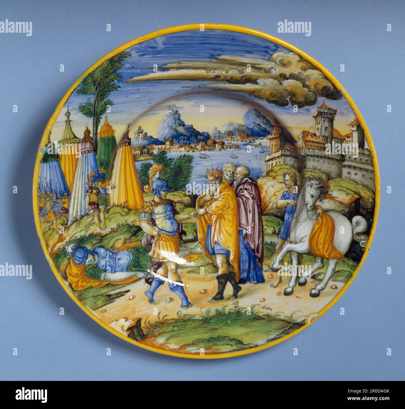 [Front]. The Legend of Hector, 1550-1560. Attributed to Fontana Workshop, Italy, Urbino. A Maiolica, tin-glazed earthenware plate with a circular section. Painted scene shows Priam paying a ransom for the body of his son, Hector, who was killed during the siege of Troy. Stock Photo
