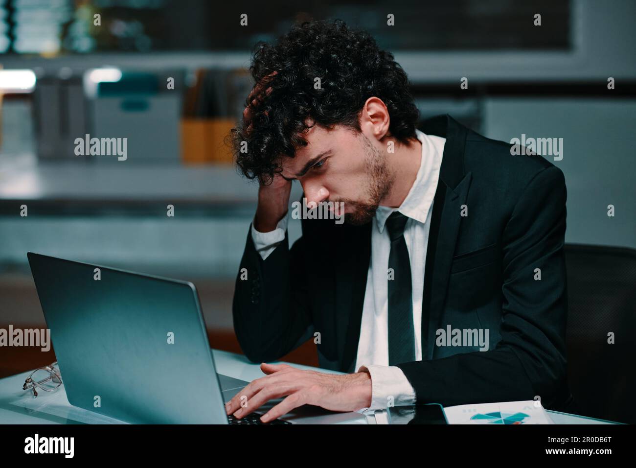 Tired confused businessman correcting mistakes in annual report Stock ...