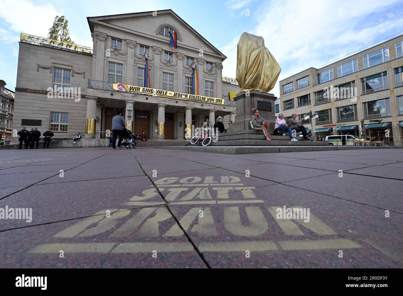 Weimar, Germany. 08th May, 2023. The Goethe-Schiller monument in front of the German National Theater on Theaterplatz is covered with gold-colored foil before the start of a rally by the AfD. It is an action under the motto 'Gold instead of brown'. Numerous events are taking place in Thuringia on this day to mark the day of liberation from National Socialism. Credit: Martin Schutt/dpa/Alamy Live News Stock Photo