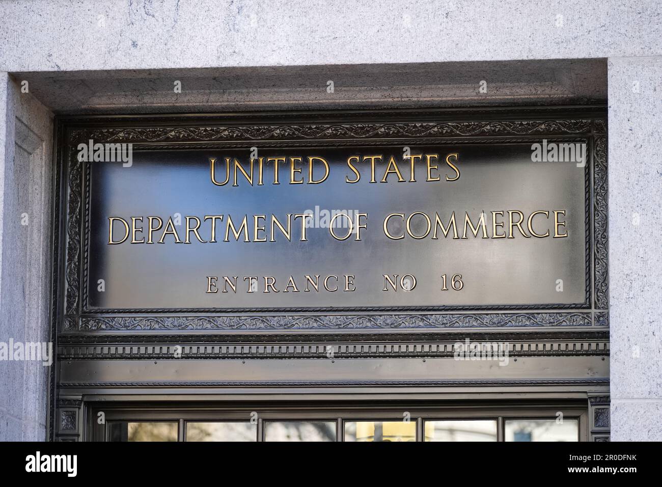 Washington, DC - April 4, 2023 : United States Department of Commerce sign and entrance at the Herbert C. Hoover Building Stock Photo