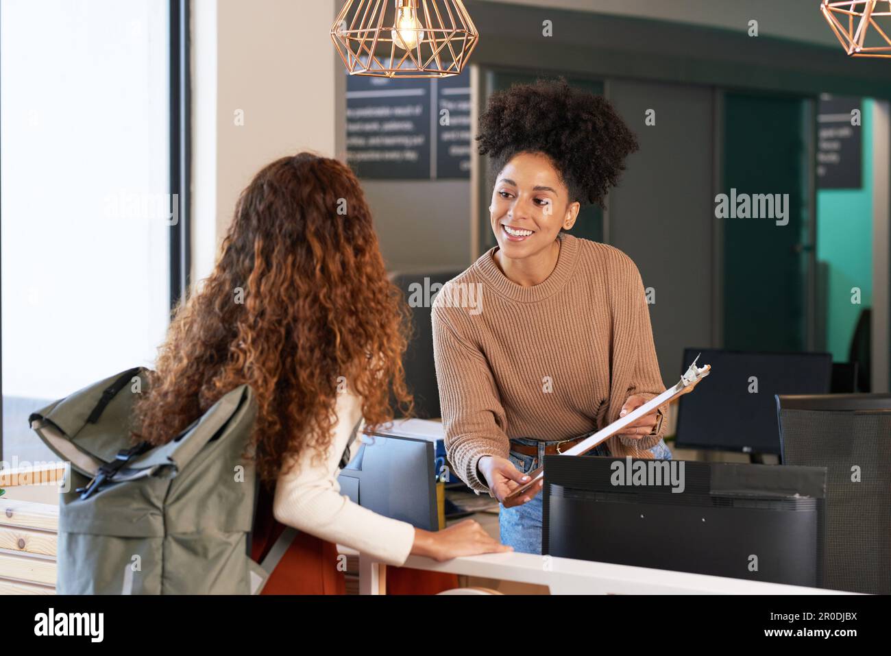 The check in desk assistant asked rob. The check in desk assistant asked rob