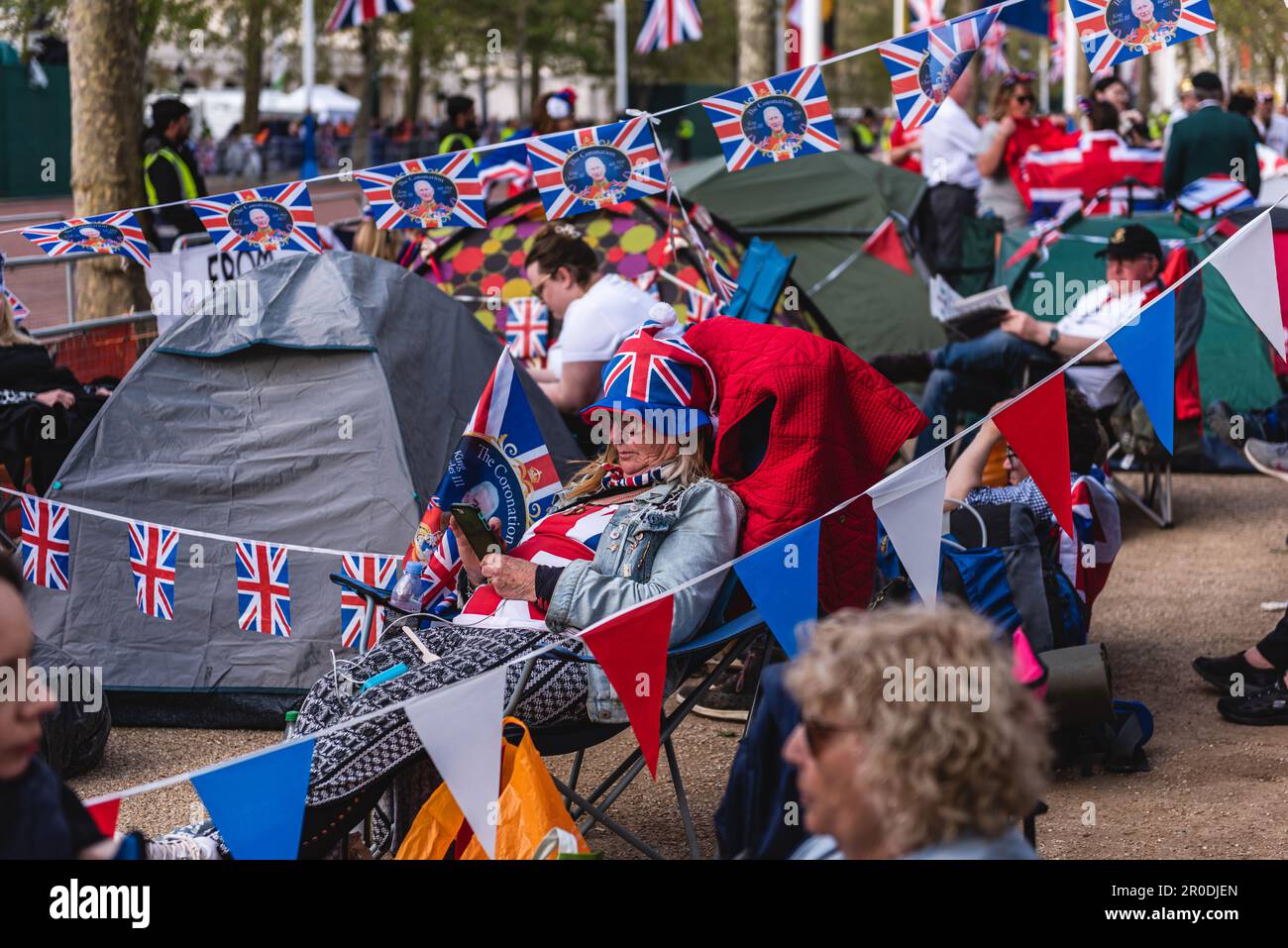 Charles III Coronation Waiting Party - Union Flag Woman reading a book ...