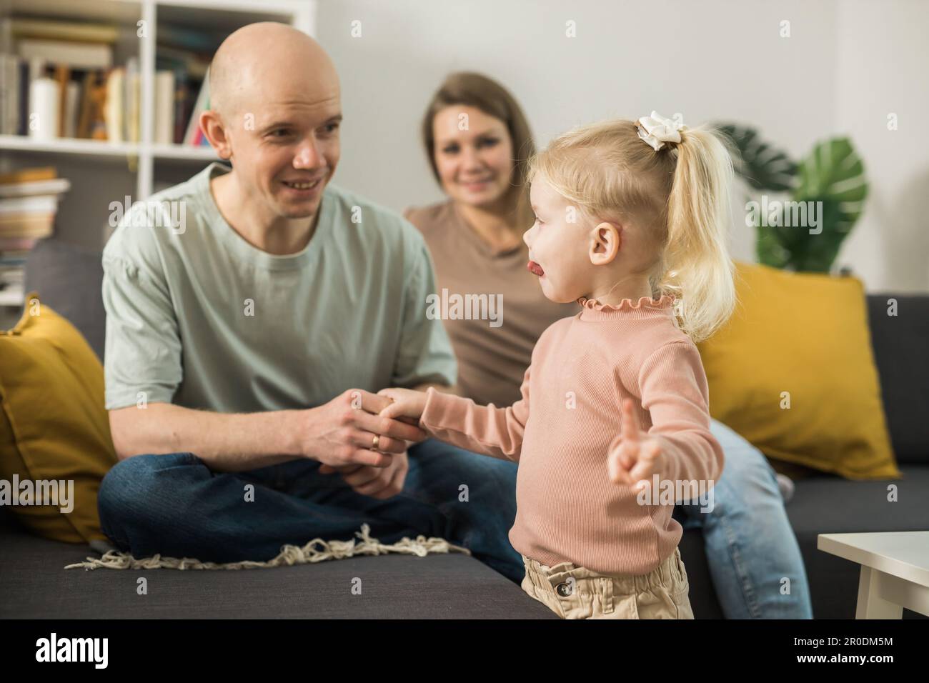 Deaf kid with hearing aid cochlear implant have fun with parents - Hear ...