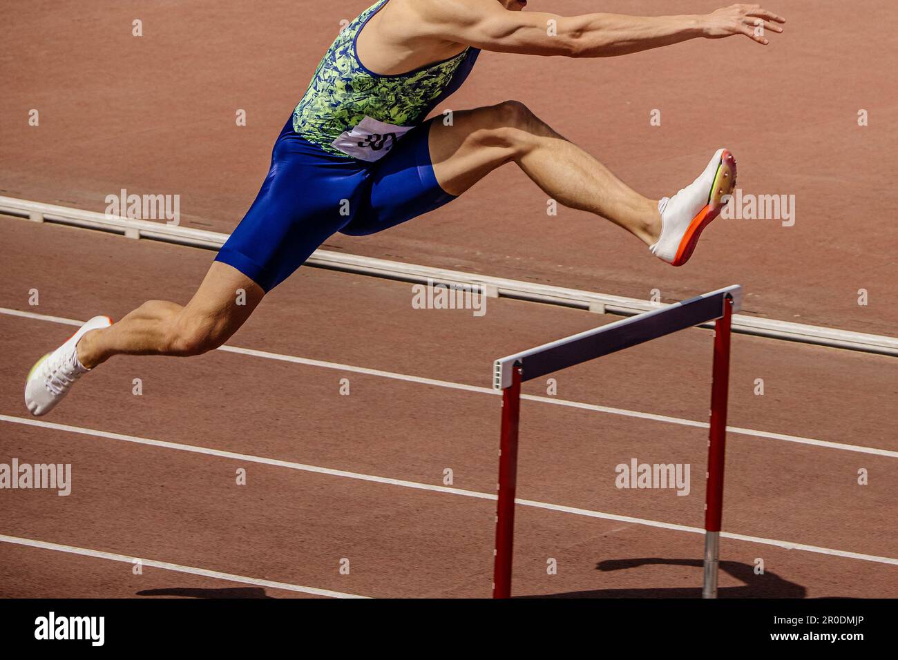 athlete runner running 400 metres hurdles is track and field hurdling
