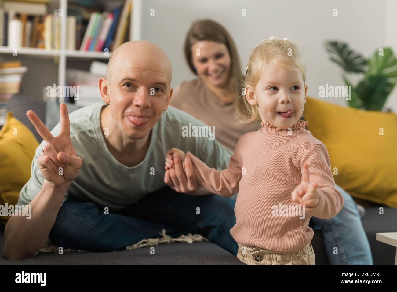 Deaf kid with hearing aid cochlear implant have fun with parents - Hear ...