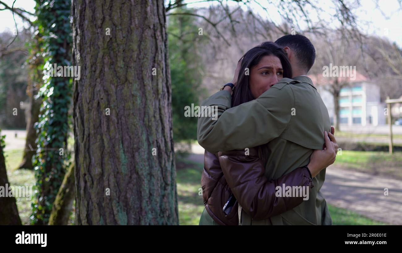 Compassionate embrace between a suffering couple. Empathic moment