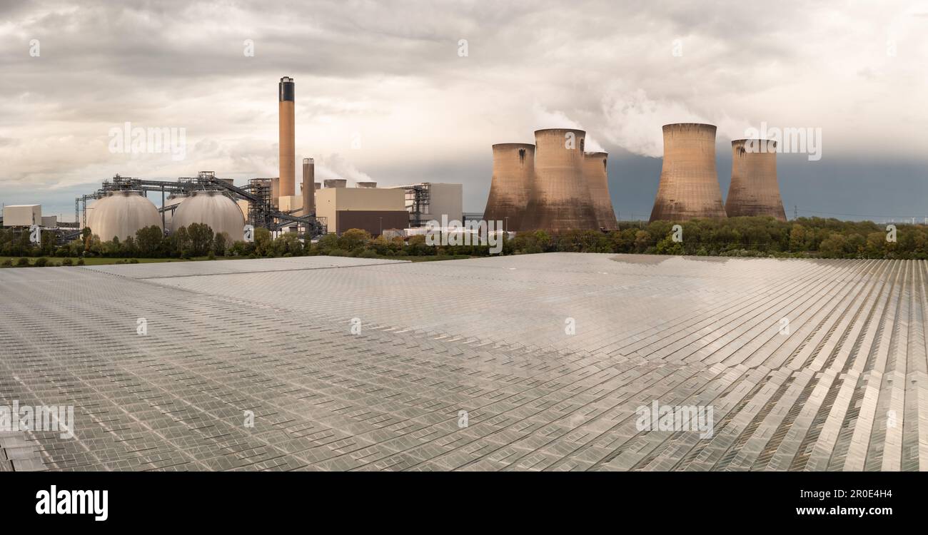 Aerial view of Drax Power Station in North Yorkshire and English Village Salads using excess heat to warm greenhouses for salad growing food production Stock Photo