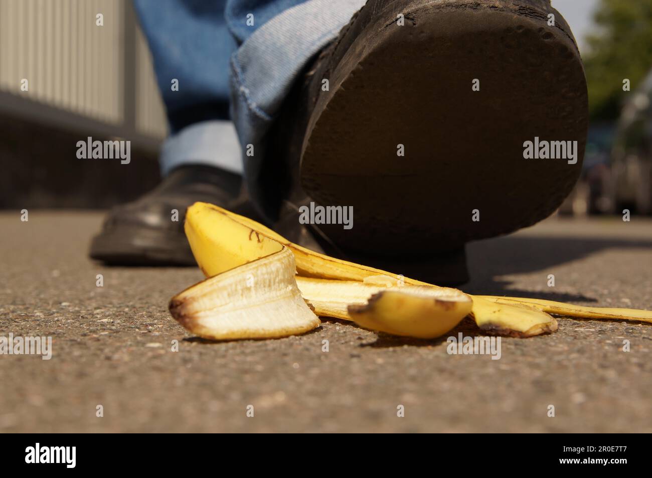 person about to slip on a banana peel or banana skin Stock Photo Alamy