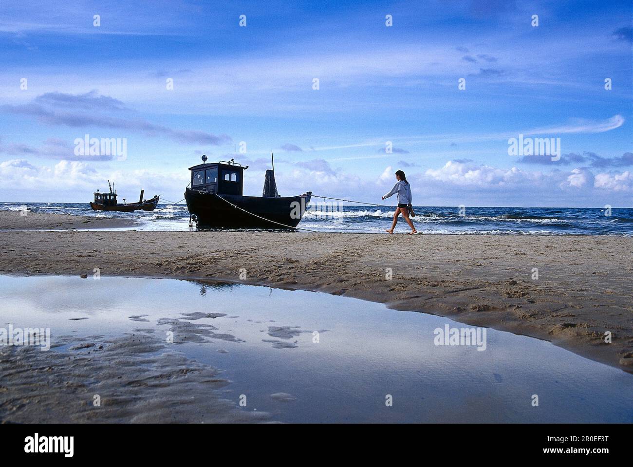 Woman in profile alone on beach hi-res stock photography and images - Alamy