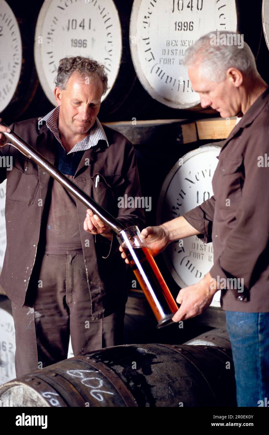 Two men testing whiskey at Ben Nevis distillery, Fort William