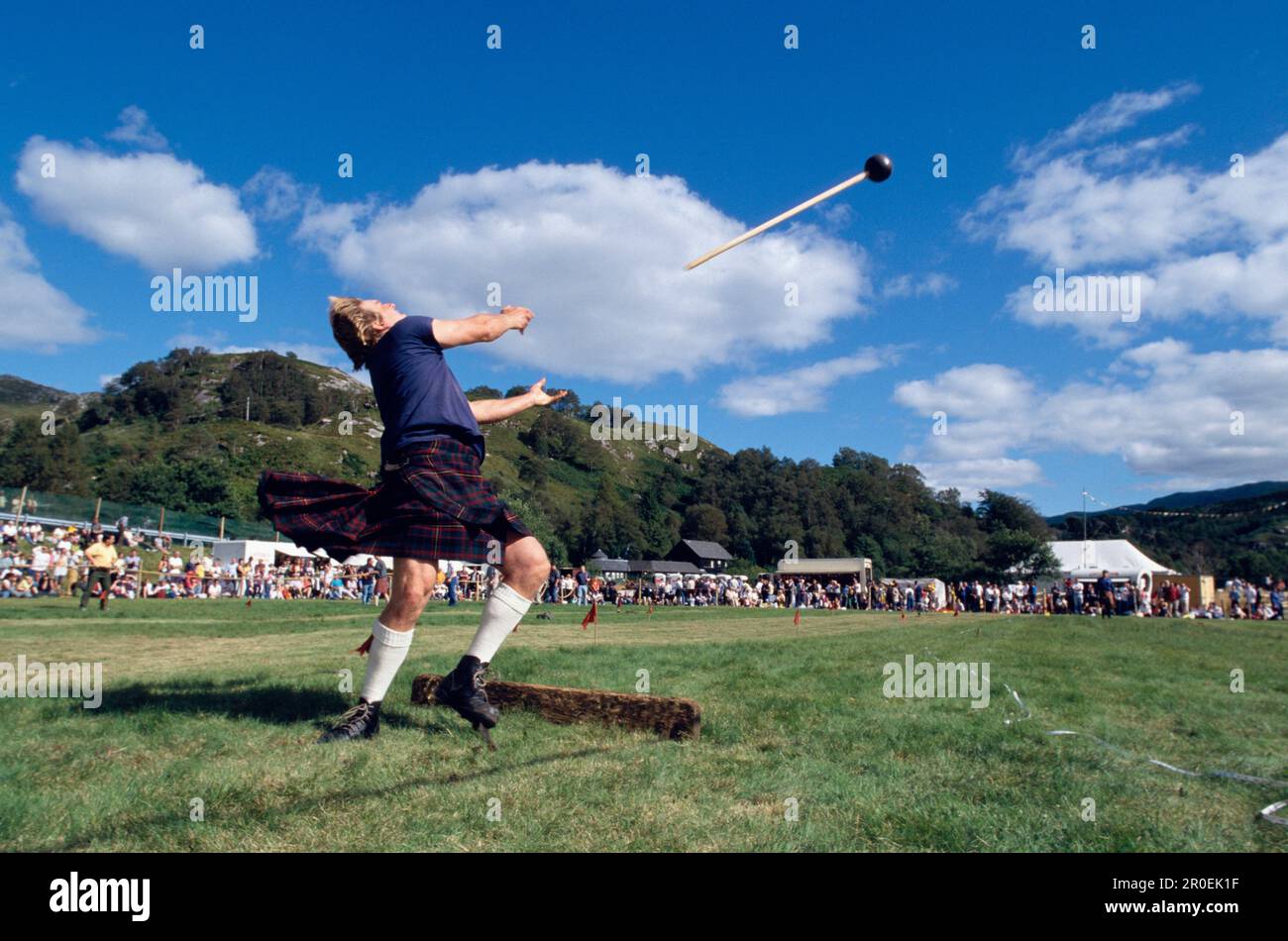 Man with kilt throwing a sledge hammer, Glenfinnan Highland Games
