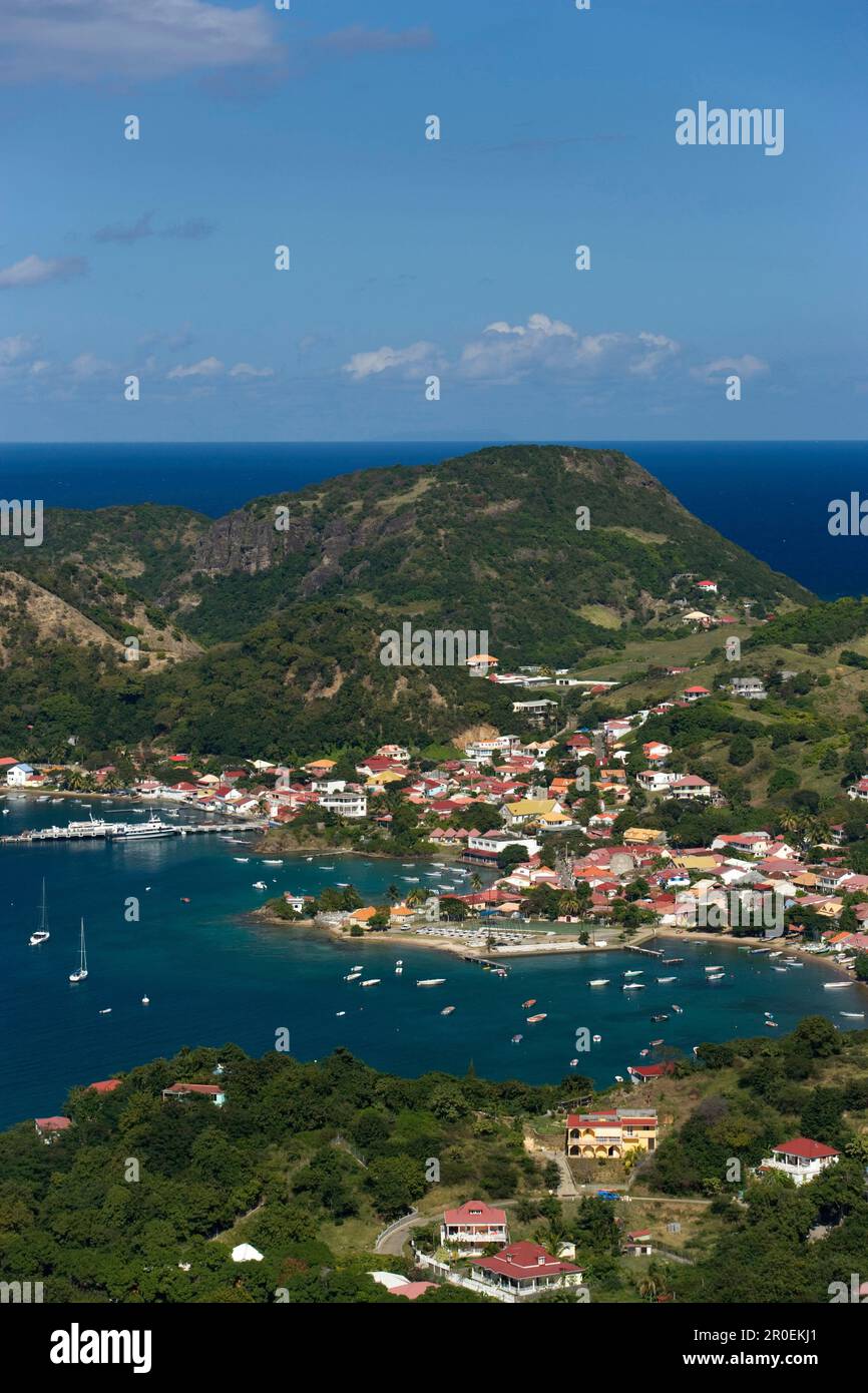 Aerial View towards Terre-de-Haute, boats in the harbour surrounded by mountains, Les Saintes Islands, Guadeloupe, Caribbean Sea, Caribbean, America Stock Photo
