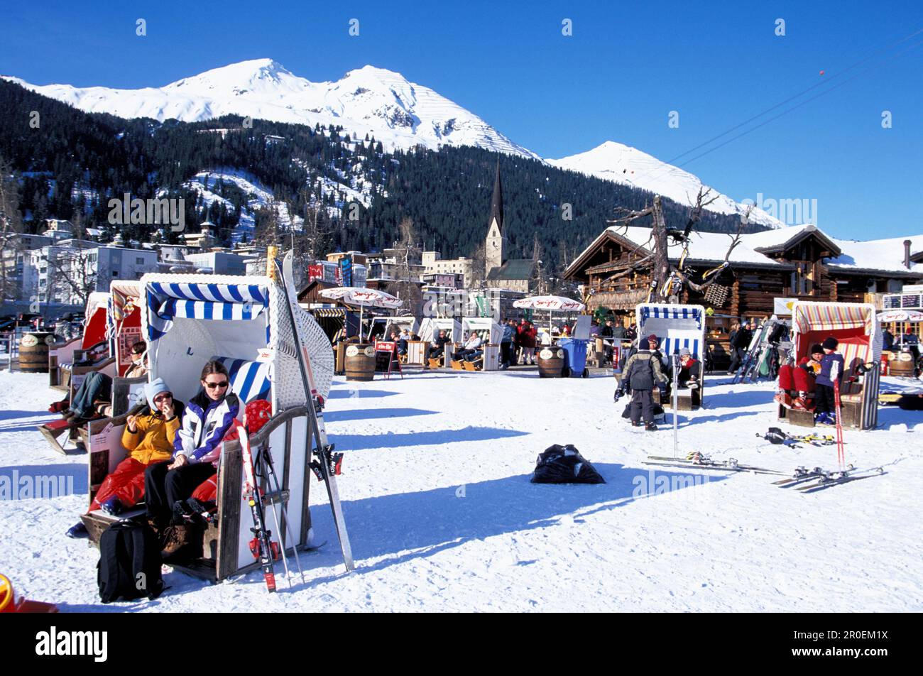 People at Aprés Ski in beach chairs, Bolgen Plaza, Davos, Grisons, Switzerland, Europe Stock Photo