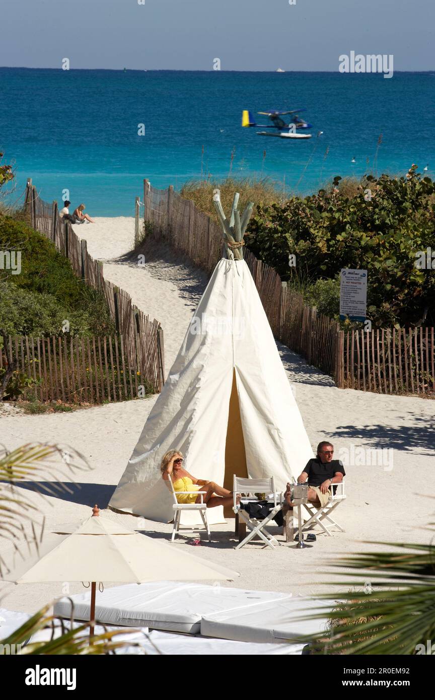 Ultra Light Plane passing, beach cafe, Tipi, Nikki Beach Club, South Beach, Miami, Florida, USA Stock Photo