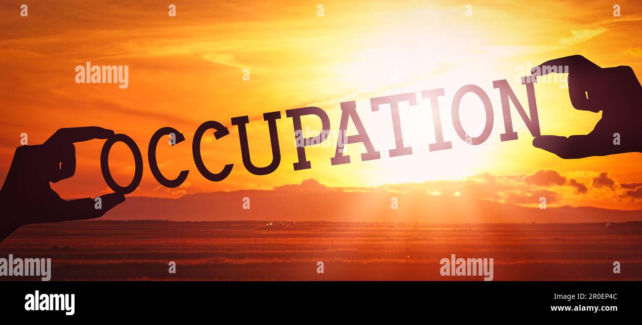 Occupation Using Hand Occupation - human hands holding black silhouette word Stock Photo - Alamy