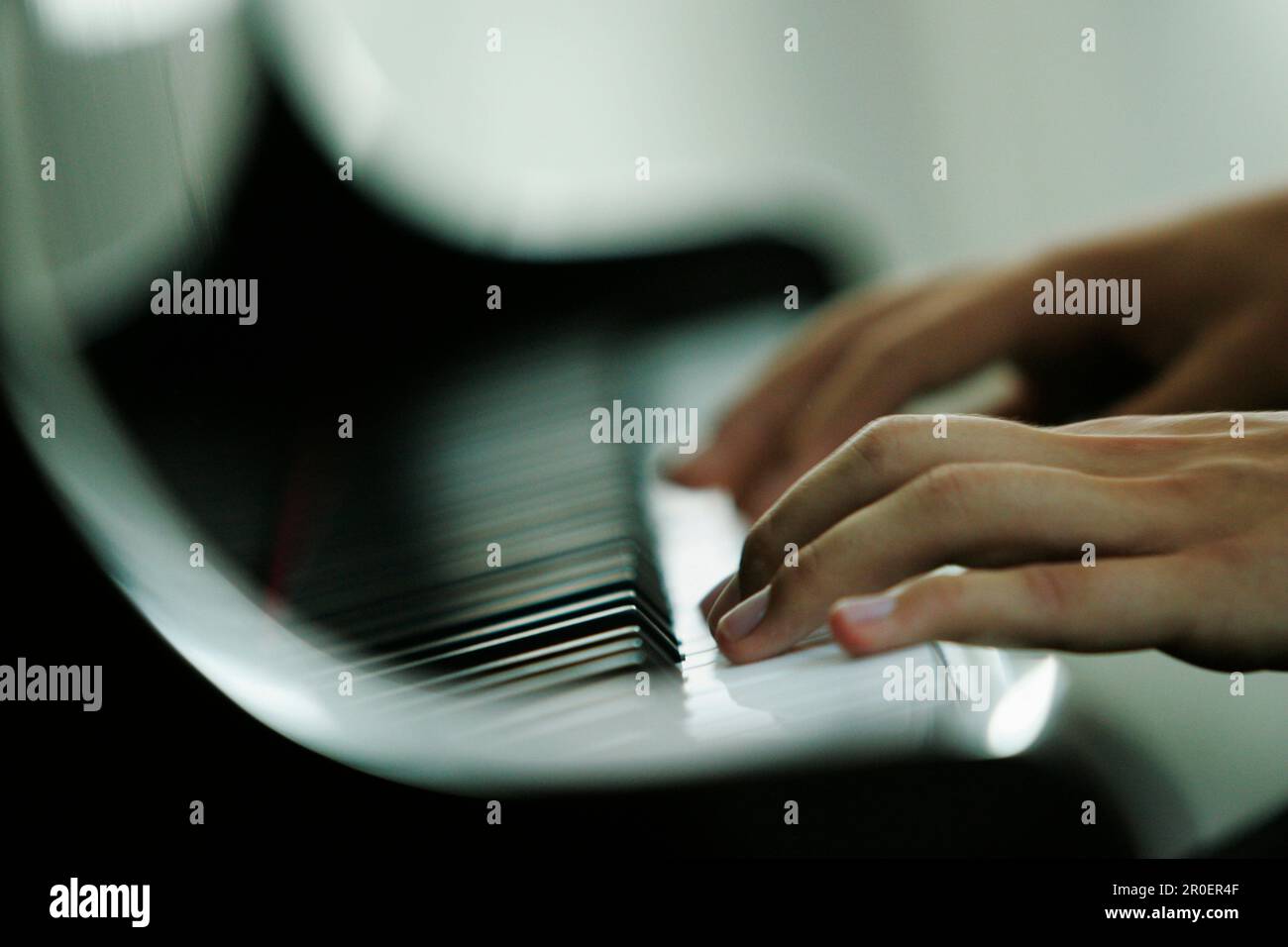 Man playing piano, close-up hands, Germany Stock Photo