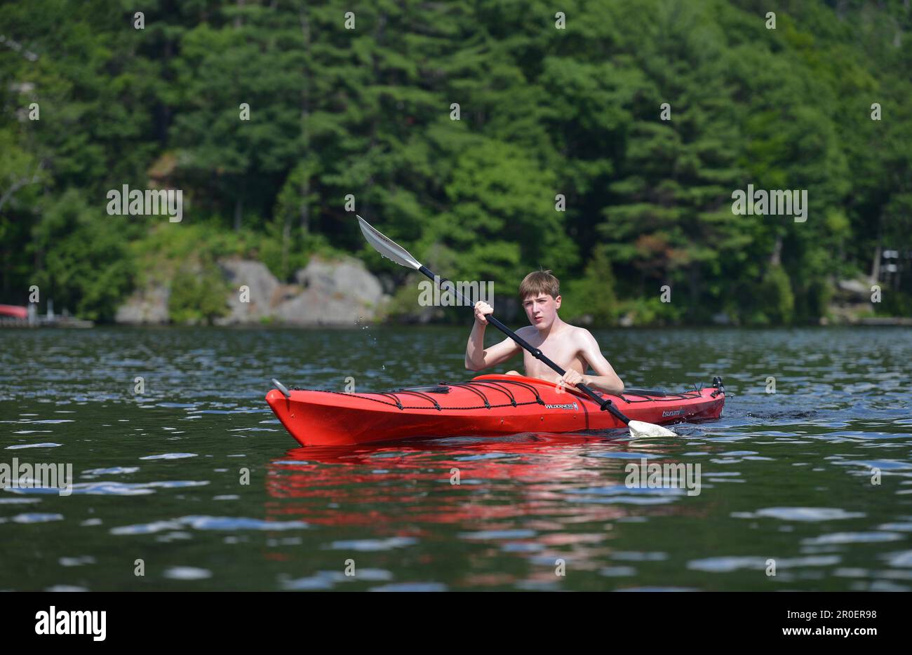 Boy in a canoe, Gatineau River, Quebec, Canada Stock Photo
