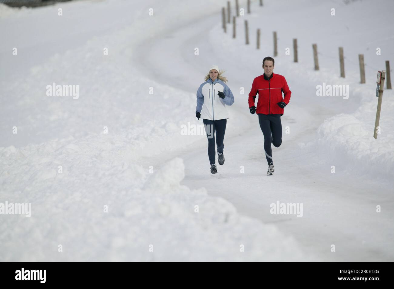 Young couple running on track Stock Photo