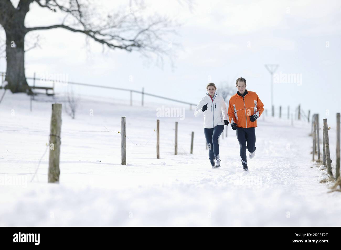Young couple running on track Stock Photo
