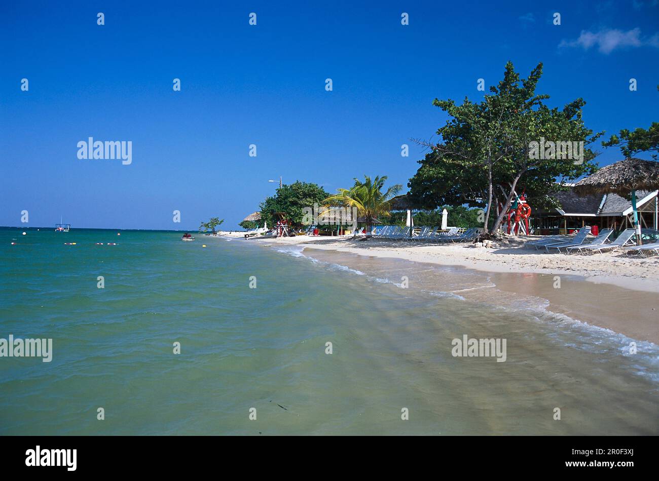 Beach with sunloungers under blue sky, Beach Club, Ritz Charlton Rose