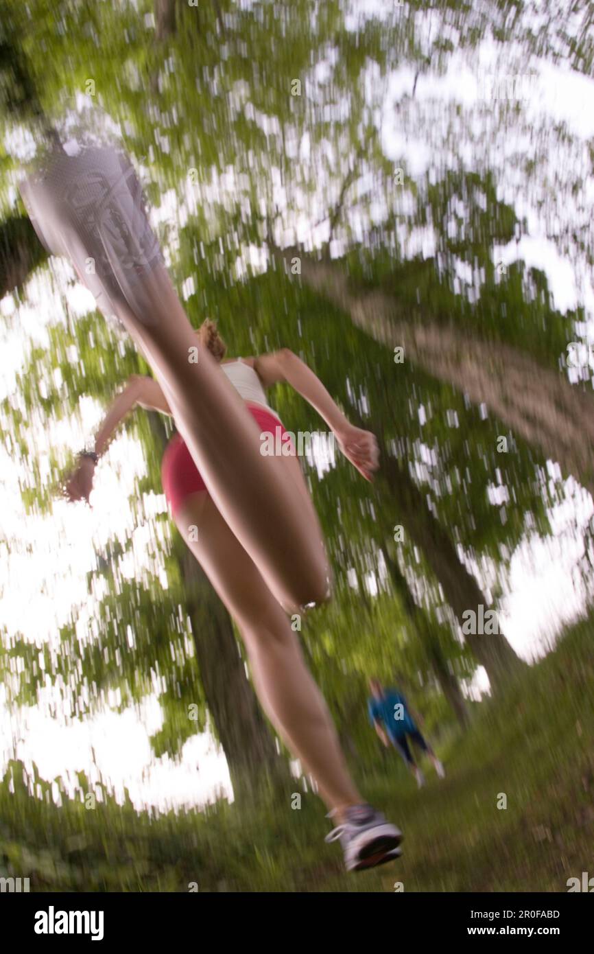 Woman jogging, low angle view Stock Photo